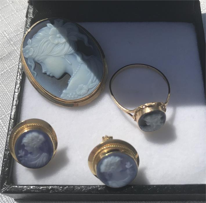 Cameo brooch, earrings, ring (size N) all mounted in yellow metal, brooch and earring marked .750, r