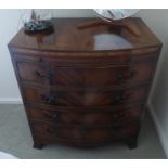Reproduction mahogany bow front chest of drawers with brushing slide 76 cms wide
