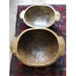 Two wooden dough bowls largest 54cms across