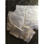 A quantity of linen and lace table cloths