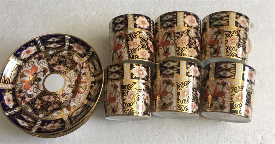 Six Royal Crown Derby and saucers