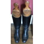 Good quality vintage riding black leather riding boots with wooden trees from Harrods, London.