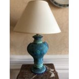 Blue pottery table lamp with another wire lamp