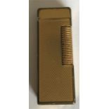 A vintage gold plated Dunhill rollagas lighter