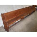 A pine and oak church pew - 13ft 6ins long, 3ft 4ins high & 18ins wide.