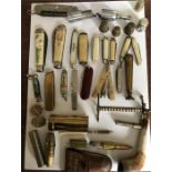 A large collection of miscellaneous to include penknives, thimbles, a bullet lighter, cuff links,