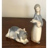 Lladro figure of lady and a pig with a Nao figure of a cat.