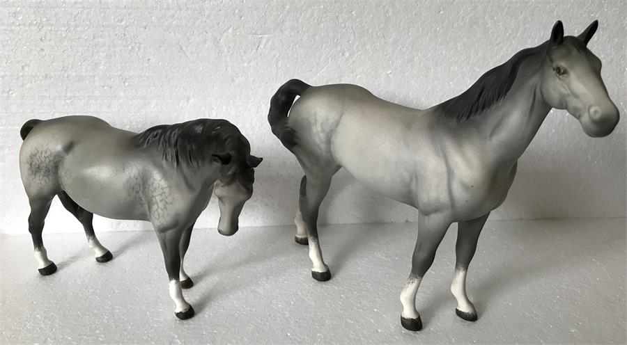 Two Beswick dapple grey horses.