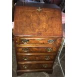 A good quality well fitted reproduction yew wood bureau