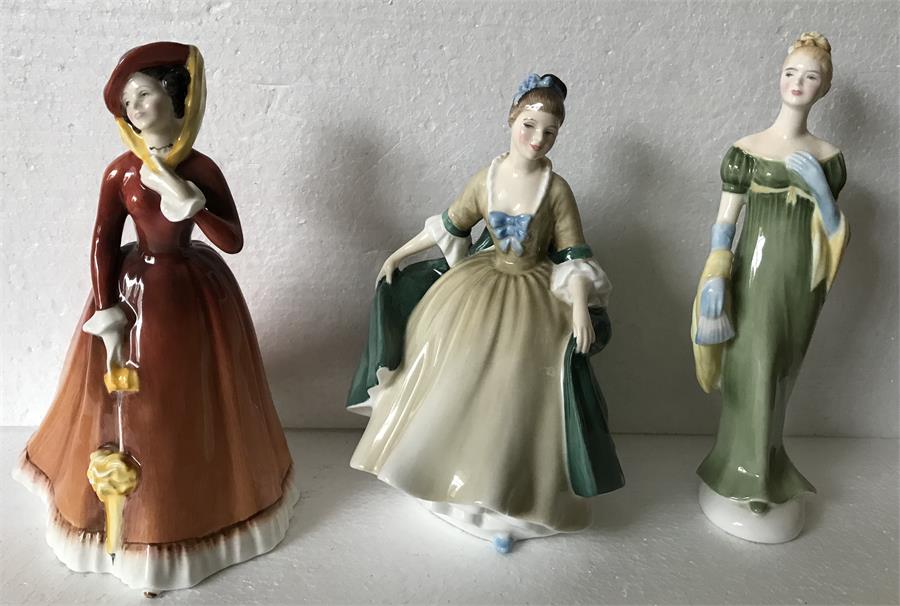 Three Royal Doulton figurines.