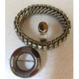 Three pieces of vintage jewellery to include expanding diamanté bracelet, silver and tigers eye ring