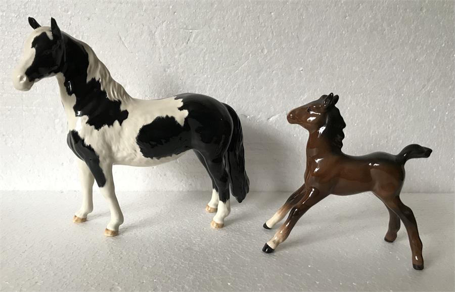 Two Beswick horses