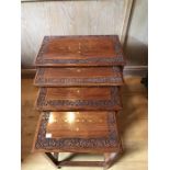 Nest of four hardwood brass inlaid tables