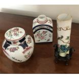 Three ceramics items, two damaged and a tea caddy lacking lid one with hardwood stand