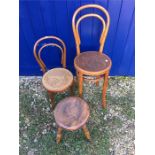 Two bentwood chairs and a footstool