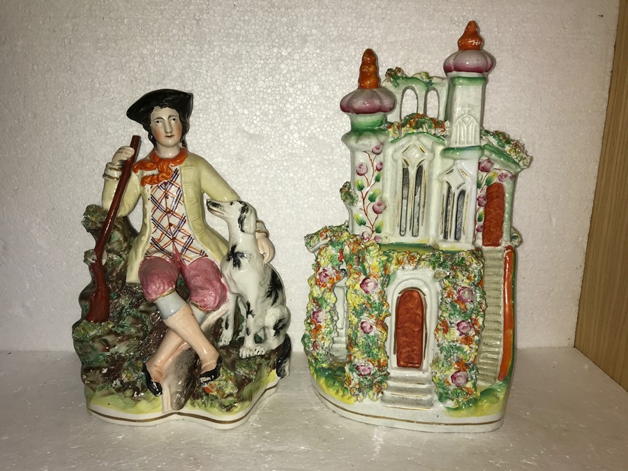 Two Staffordshire figures, house and huntsman. House 31cms h with nibbles.