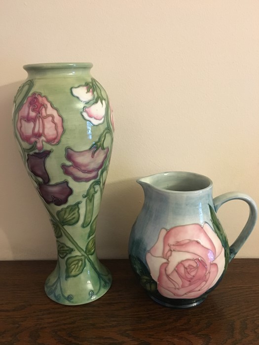 Moorcroft sweet pea pattern vase 27cms h with rose pattern jug - slight grazing to glaze 14.5cms