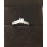 An 18ct white gold and diamond solitaire ring size R