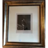 Rembrandt print of a man by a stair rail well framed