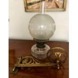 Good 19thC oil lamp on swinging bracket