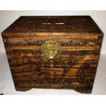 A Chinese carved camphorwood box with decorative brass fitting. 35cms l x 23cms d x 29cms h