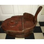 A wooden stained and coopered baby bath/ training potty?