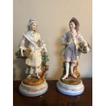 Pair 19thC figures, a man and woman both with roses 30cms high