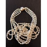 Good quality four strand baroque pearl necklace with 14 ct gold clasp