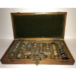 A good quality early 20thC oak optometry case and contents, maker - F.Davidson & Co. 29 Gt. Portland