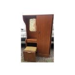 A 1970’s Teak veneered hall cupboard with pullout stool - 175cms h, 108cms w, 35cms d