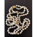 Good quality baroque pearl necklace the two strands held by a 14ct gold clasp