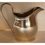 A helmet-shaped silver cream jug, maker - George Nathan & Ridley Hayes, Chester 1902, 3.2oz - 9.5cms