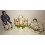 Three 19thC Staffordshire figures, including castle, girl with dog and seated gentleman 16cms h.