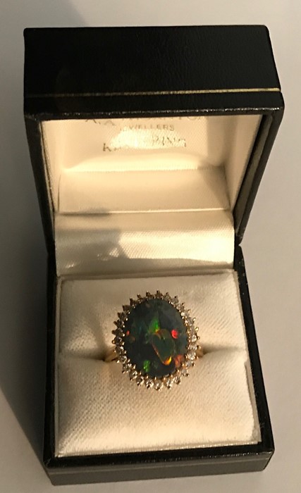 Black opal and diamond cluster ring set in 18ct yellow gold, opal 15mms x