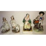 Four 19thC Staffordshire figures including organ grinder with a monkey. Slight chips to paint.