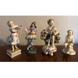 Four various porcelain figures all with some damage 13cms max