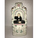 Rare Staffordshire figure of Wesley, chip to paint, 29cms h.