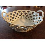 Wedgwood undecorated lattice basket c1800 with a Coalport cup and saucer