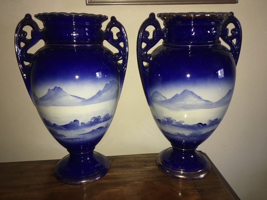 A pair of 19thC blue and white vases depicting cherubs, slight repair to one top. - 39cms h - Image 2 of 3