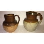 Two brown glazed jugs, one Doulton Lambeth and other with brass rim 19cms h.