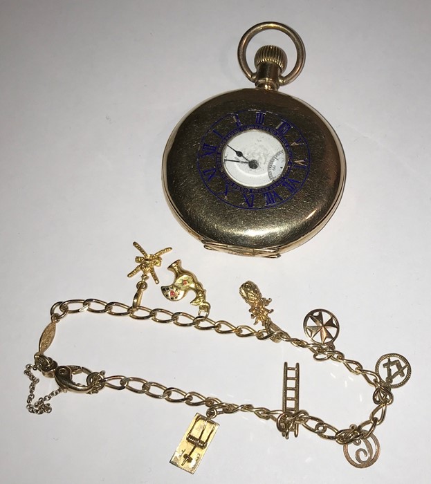 A 14 ct gold charm bracelet and charms, 12.8gms together with yellow metal pocket watch.