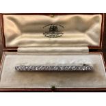 Platinum and diamond bar brooch with 22 Old European cut diamonds