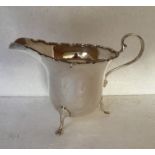 A silver cream jug - Adie Brothers, Birmingham 1920.