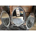 A freestanding triple dressing table mirror