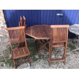 Teak octagonal table and four folding chairs - 108cms d