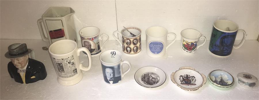 A collection of ceramics, mainly cups depicting Winston Churchill and a Johnny Walker jug from the