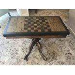 An unusual walnut games table on associated mahogany base 82 w x 40 d x 58cms h