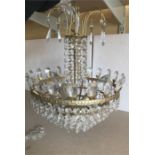 A gilt and glass electric light fitting - 56cms drop some loose beads