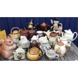 A large number of novelty teapots including Manor Farm pottery, Carlton Ware, Pentik etc...