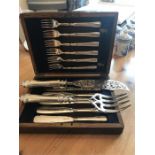 Silver plated knive and fork set in original oak case together with ornate Elkington plated fish